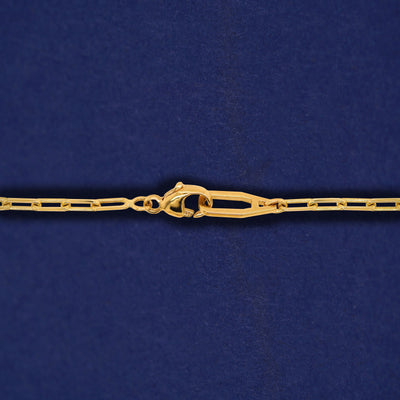 Close up view of an Automic Gold AU clasp on a solid 14k yellow gold Butch Chain