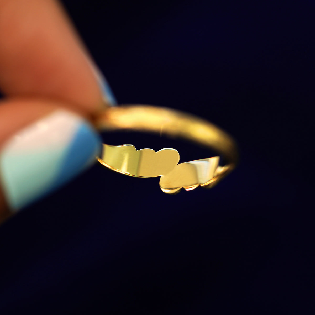Underside view of a solid 14k gold Crashing Waves Band