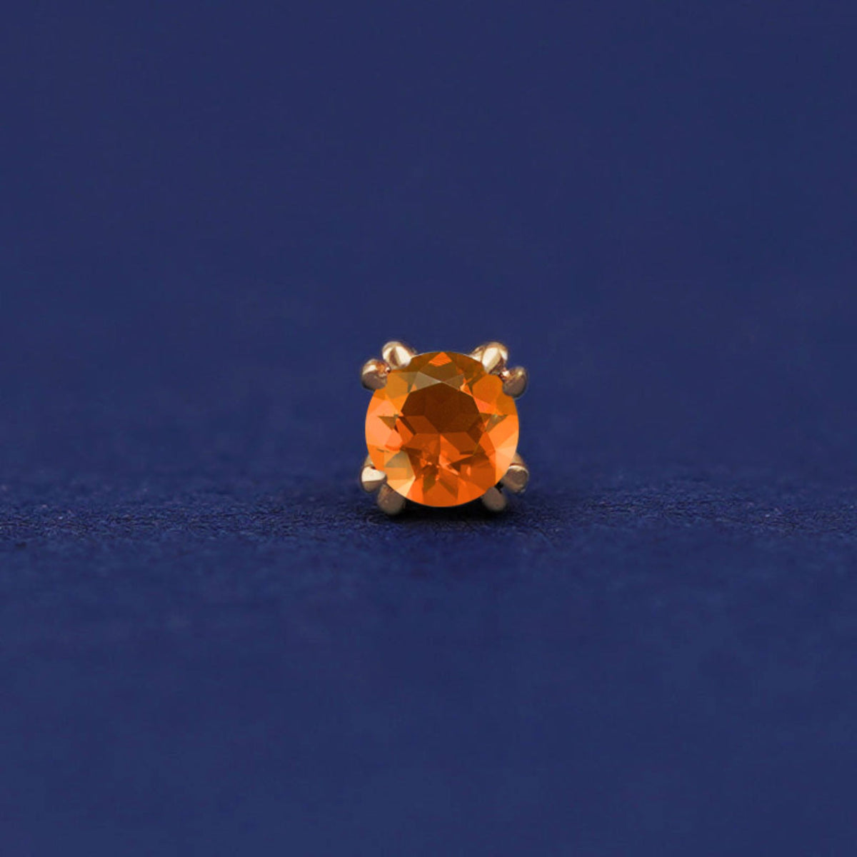 Front facing view of a 14k yellow gold orange Fire Opal Flat Back Earring