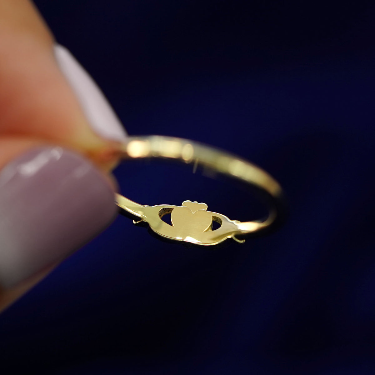 Underside view of a solid 14k gold Thin Claddagh Ring