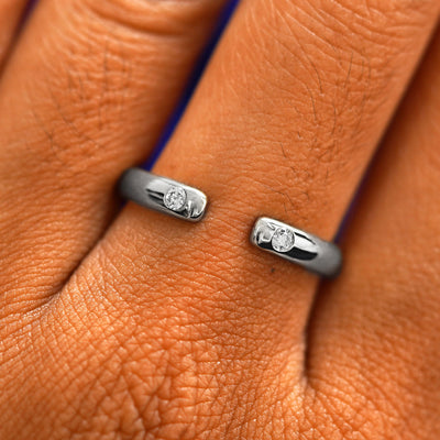 Close up view of a model's fingers wearing a 950 platinum Open Curvy Band