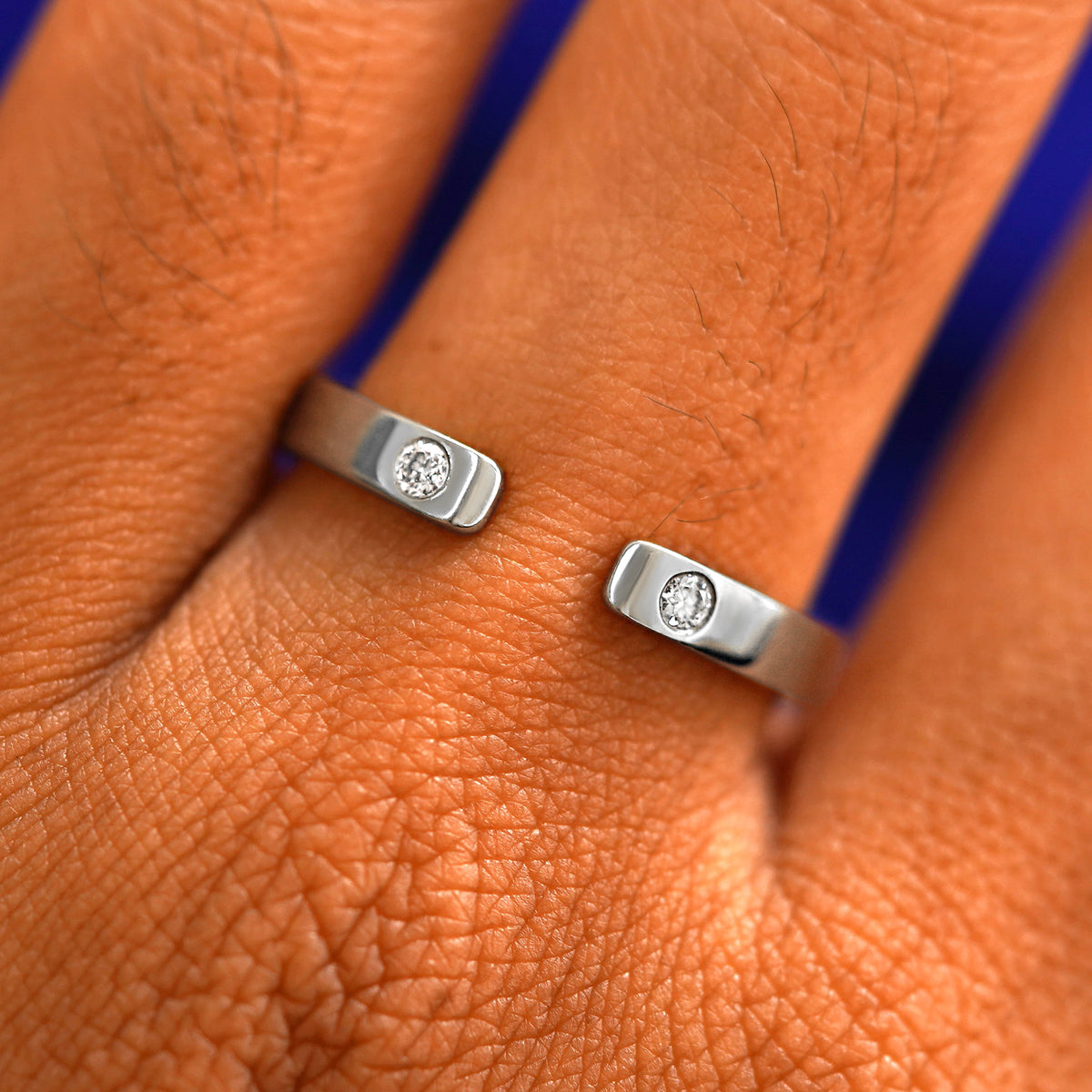 Close up view of a model's fingers wearing a 950 platinum Open Industrial Band