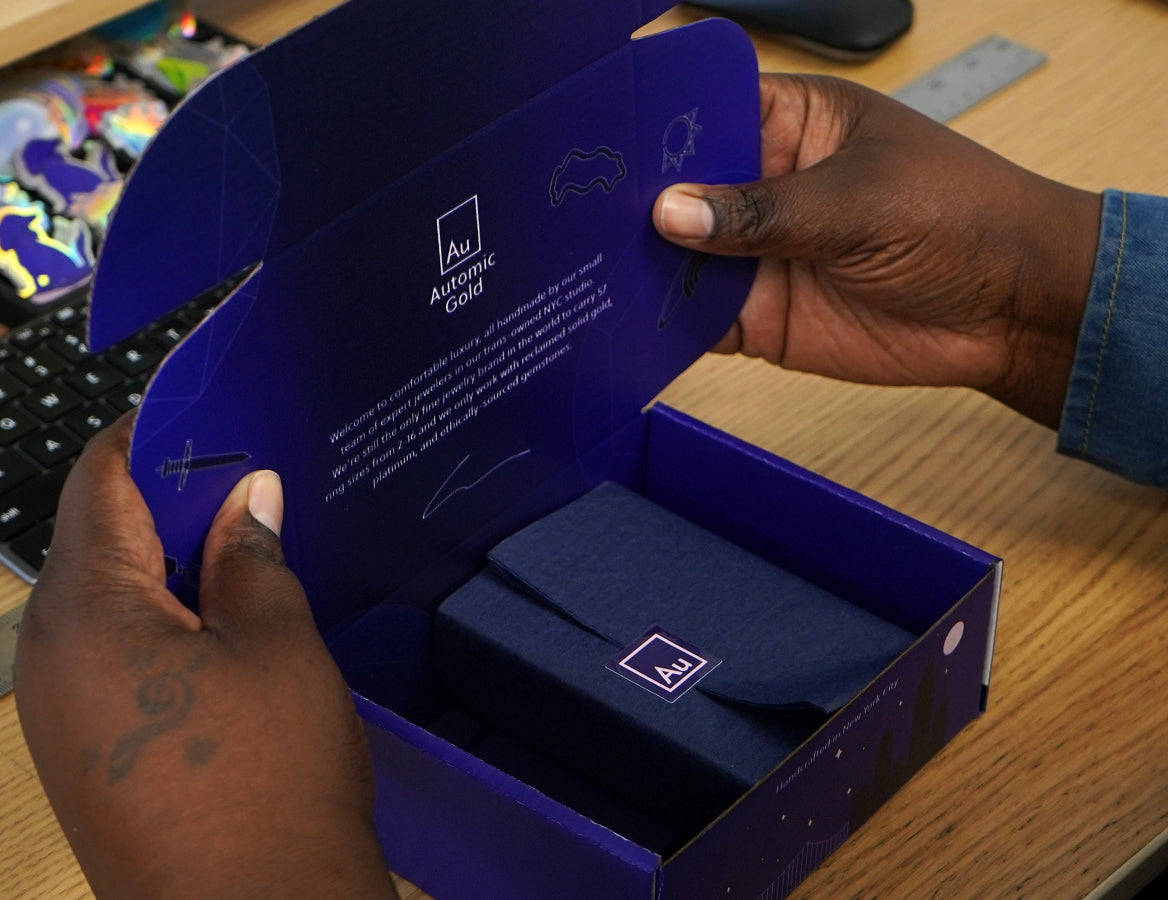 Our shipping manager packaging an order in our Automic Gold box