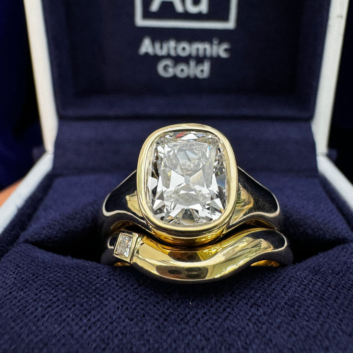 14k Yellow Gold Thick-bezel-set ~1.5ct G/VVS Antique-cut Cushion Lab Diamond on Thick Tapered Band Custom Ring & 14k Yellow Gold Custom 3mm Nesting Band with Princess-cut Diamond