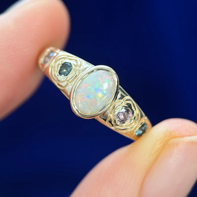 14k Yellow Gold Bezel-set 0.49ct Oval Australian Opal with 4pc Pink and Blue Sapphires inside Rose Engravings on Custom Tapered Band, size 7.5