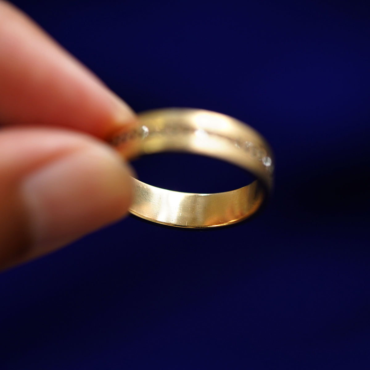 Underside view of a solid 14k gold Endless Diamond Band