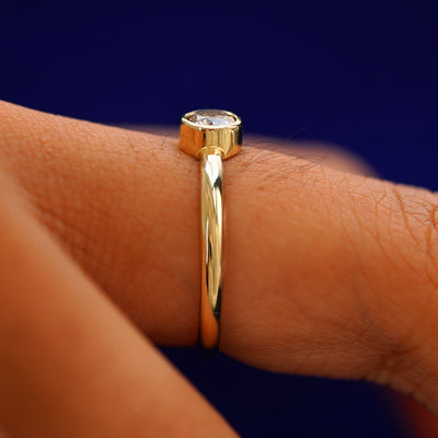 Side view of a 1/3ct Diamond Ring on a model's finger