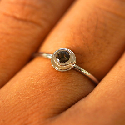 Close up view of a model's fingers wearing a champagne gold Coffee Cup Ring