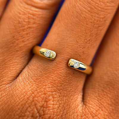 Close up view of a model's fingers wearing a 14k champagne gold Open Curvy Band