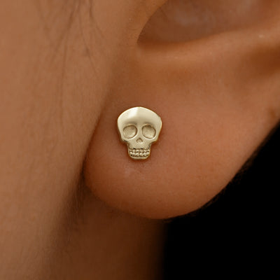 Close up view of a model's ear wearing a 14k champagne gold Mushroom Earring
