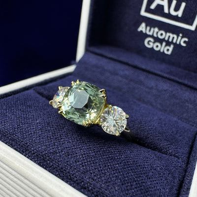 14k Yellow Gold Bezel-set 3.17ct Customer’s Cushion Sapphire w/ 2pc 5mm Round Moissanites on 2mm Curvy Band Custom Ring