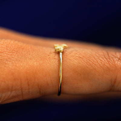 Side view of a Dog Ring on a model's finger