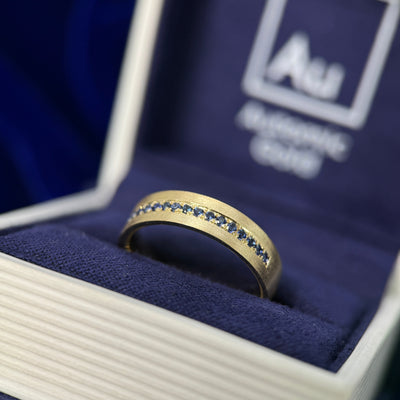 14k Yellow Gold & Dark Blue Sapphires 3/4 around Custom Band in a blue ring box