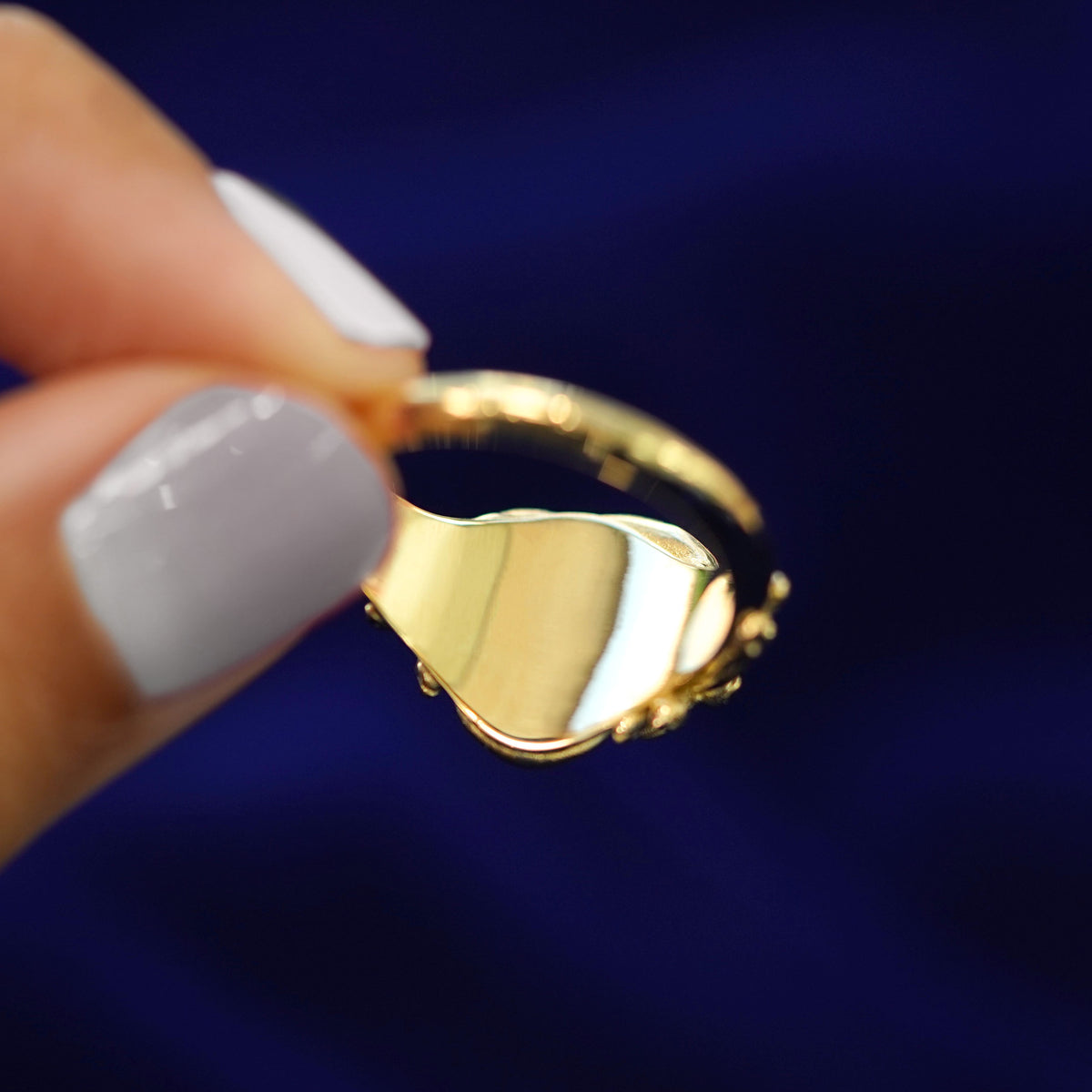 Underside view of a solid 14k gold Medusa Ring