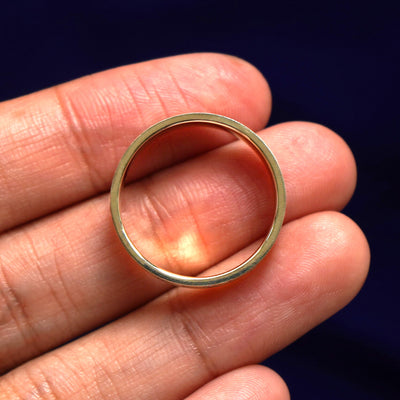 A Stars and Diamonds Band in a model's hand showing the thickness of the band