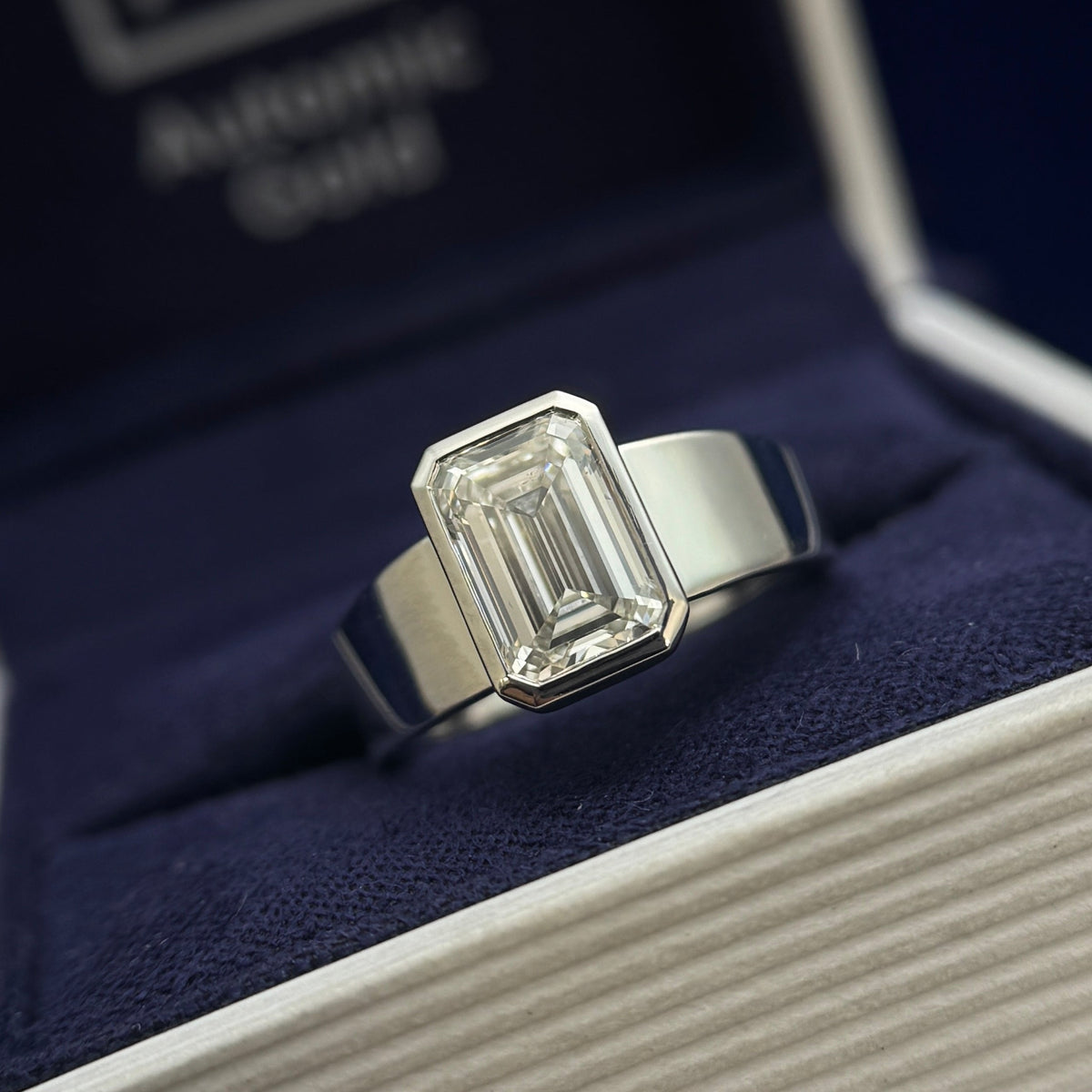950 Platinum Bezel-set 2ct Emerald-cut Lab Diamond on 6-2mm Tapered Band Custom Ring, Size 4.75