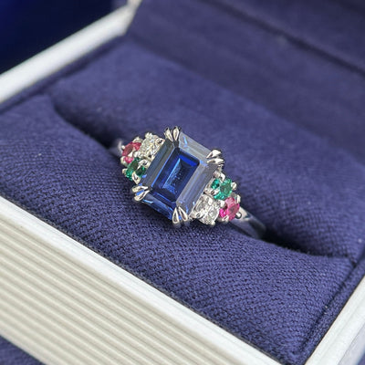 14k White Gold with Low-set Emerald-cut 6x8mm Blue Lab Sapphire with 2.5mm Round Lab Ruby, Lab Emerald, Moissanite with hidden Orange Engraved Custom Ring
