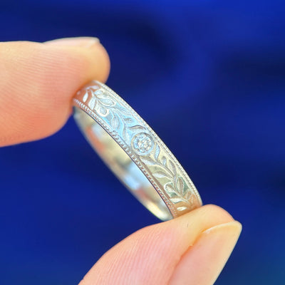950 Platinum with Flush-set 2.5mm Diamond on 4.5mm Industrial Mirror Band with Milgrain and Olive Leaves engraving Custom Ring, size 10