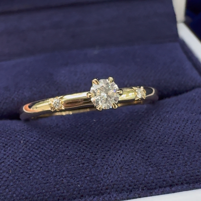 14k Yellow Gold Six-prongs-set 0.15ct (~3.5mm) Round Lab Diamond w/ Four-point-star-set 2pc 1.2mm Round Lab Diamonds on 2mm Curvy Band Custom Ring in a blue ring box