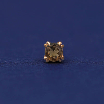 Front facing view of a 14k yellow gold Smokey Quartz Flat Back Earring