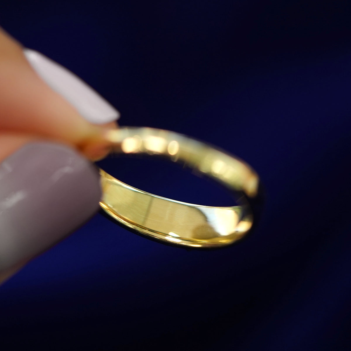Underside view of a solid 14k gold Gemstone Claddagh Band