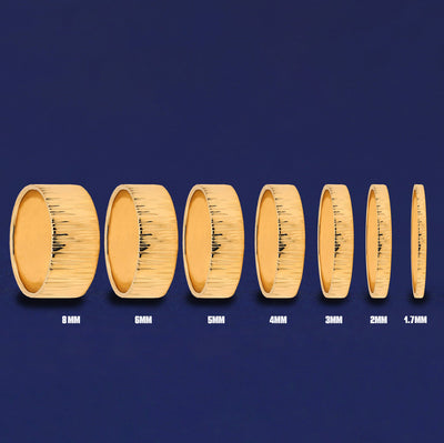Seven versions of the Industrial Wood Band showing the different thickness options of the ring from 8mm to 1.7mm