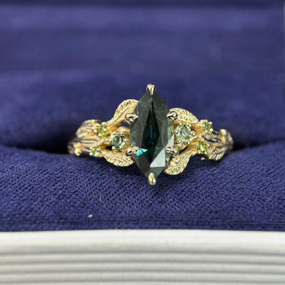 14k Yellow Gold & 6-claw-prongs-petal High-set 1.46ct 11x5.2mm Marquise Sapphire & Cluster of 6 Green Sapphires on Custom Leaves Tapered Band