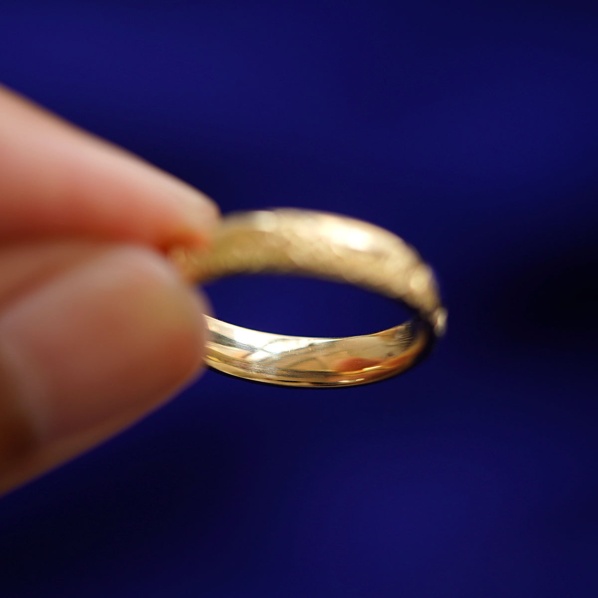 Underside view of a solid 14k gold Mountains Band
