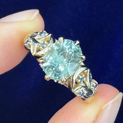 14k Yellow Gold and 2.21ct 8.1x6.5mm Oval Sapphire set into Leaves and Moons with Round Small Sapphires Custom Engagement Ring, size 7