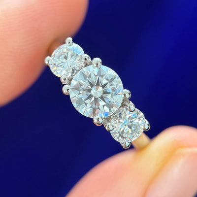 950 Platinum with 7mm 1.25ct Round Moissanite and 1ctw 5mm Round Moissanites Custom 3-stone Ring, size 7.5