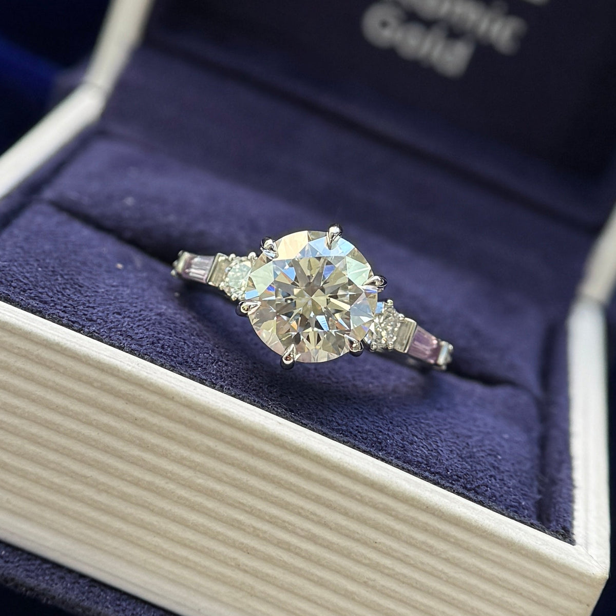 950 Platinum Claw-prongs-low-set 2.5ct Round Lab Diamond with 4pcs Round Lab Diamonds and 2pcs Tapered Baguette Sapphires on 2mm Curvy Mirror Band Custom Ring, Size 6.25