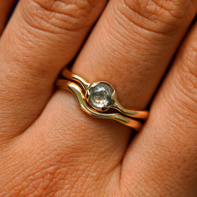 A Round Cabochon Salt and Pepper Diamond Ring stacked with a Thin Liquid Band