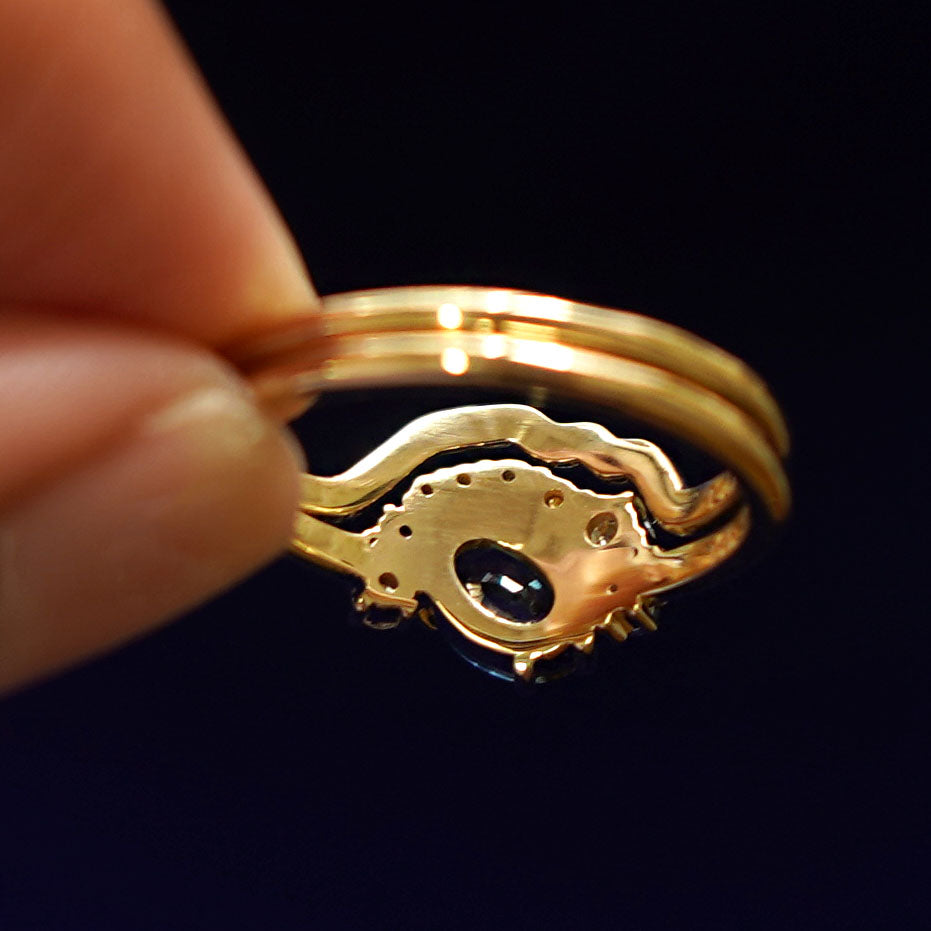 Underside view of a solid 14k gold Sapphire and Diamond Cluster Ring Set