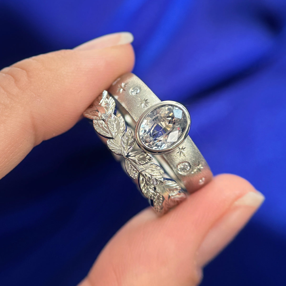 14k Champagne Gold and Bezel-set 1.62ct Champagne Sapphire on 5mm Curvy Stardust Band with Stars and White Lab Diamonds Custom Ring and 14k Champagne Gold Custom Nesting Around Double Textured Leaves Band, size 9.75