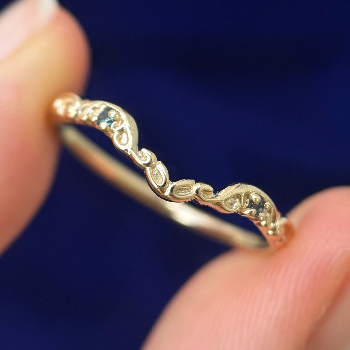 Model holding 14k Yellow Gold 2pc small Sapphires on Filigree Nesting Band Custom ring, 2 grams, Size 8