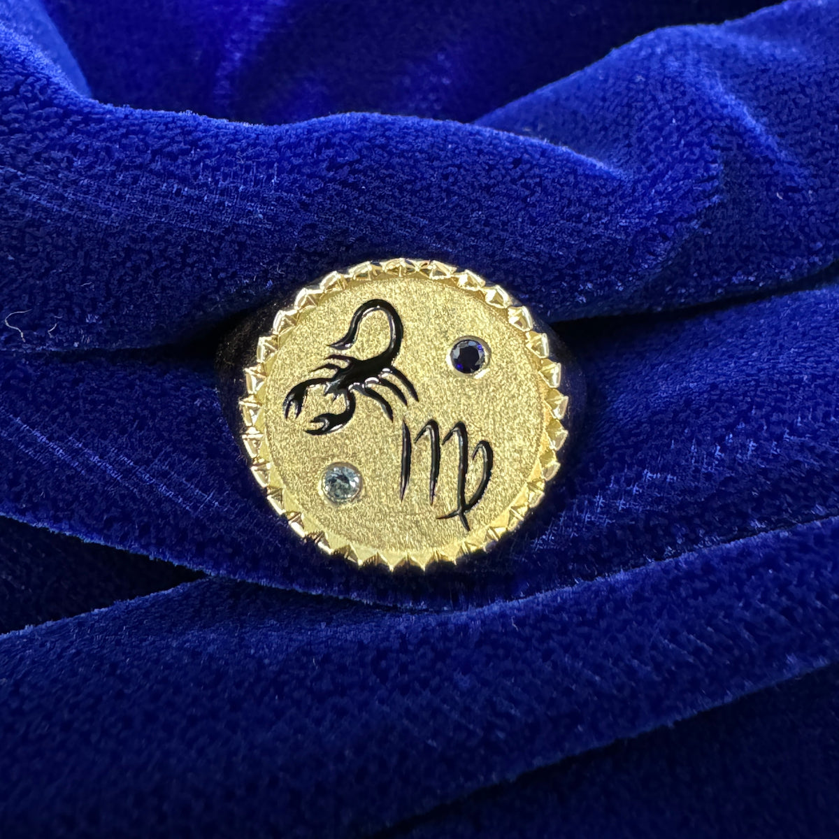 18k Yellow Gold Engraved Scorpion and Virgo Symbol with 1 Small Dark Blue and 1 Small Light Blue Sapphire and Raised Triangles Border Custom Signet Ring, size 6
