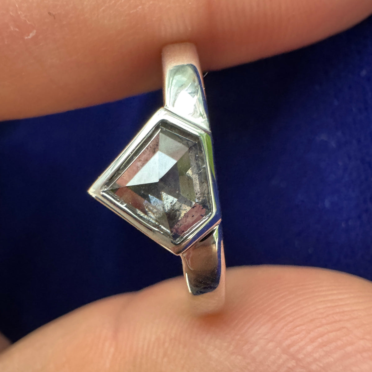 Model holding 14k White Gold Bezel-set 0.82ct Shield Salt and Pepper Diamond on Mix Mirror Band, Size 8