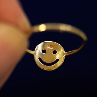 Underside view of a solid 14k gold Smiley Face Ring