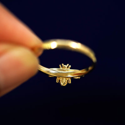 Underside view of a solid 14k gold Curvy Bee Ring