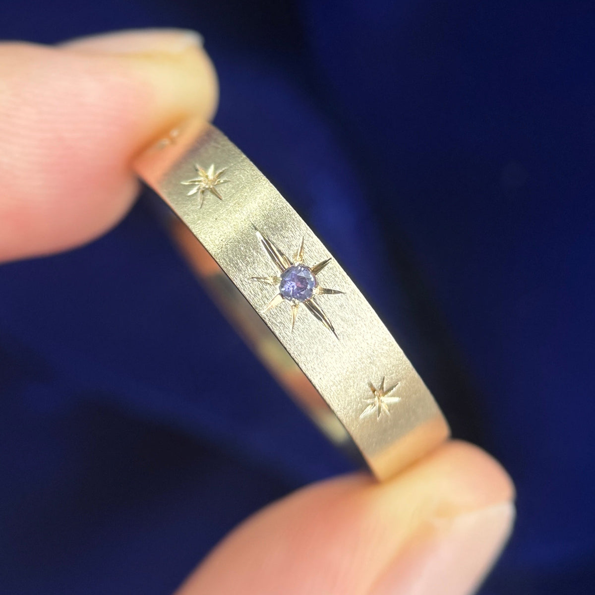 14k Yellow Gold with Star-set Lavender Sapphire on 5mm Brushed Industrial Band with 9 tiny stars engraved all around Custom Ring, size 13.5
