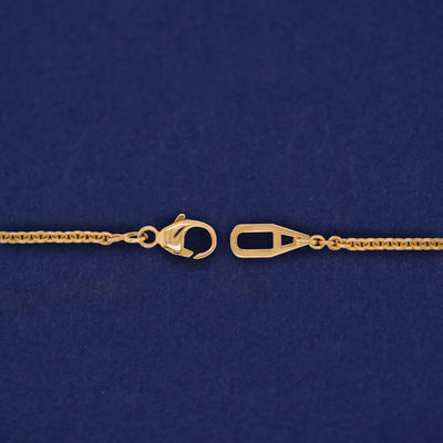 Close up view of an unclasped AU lobster claw clasp on a Bound Together Bracelet