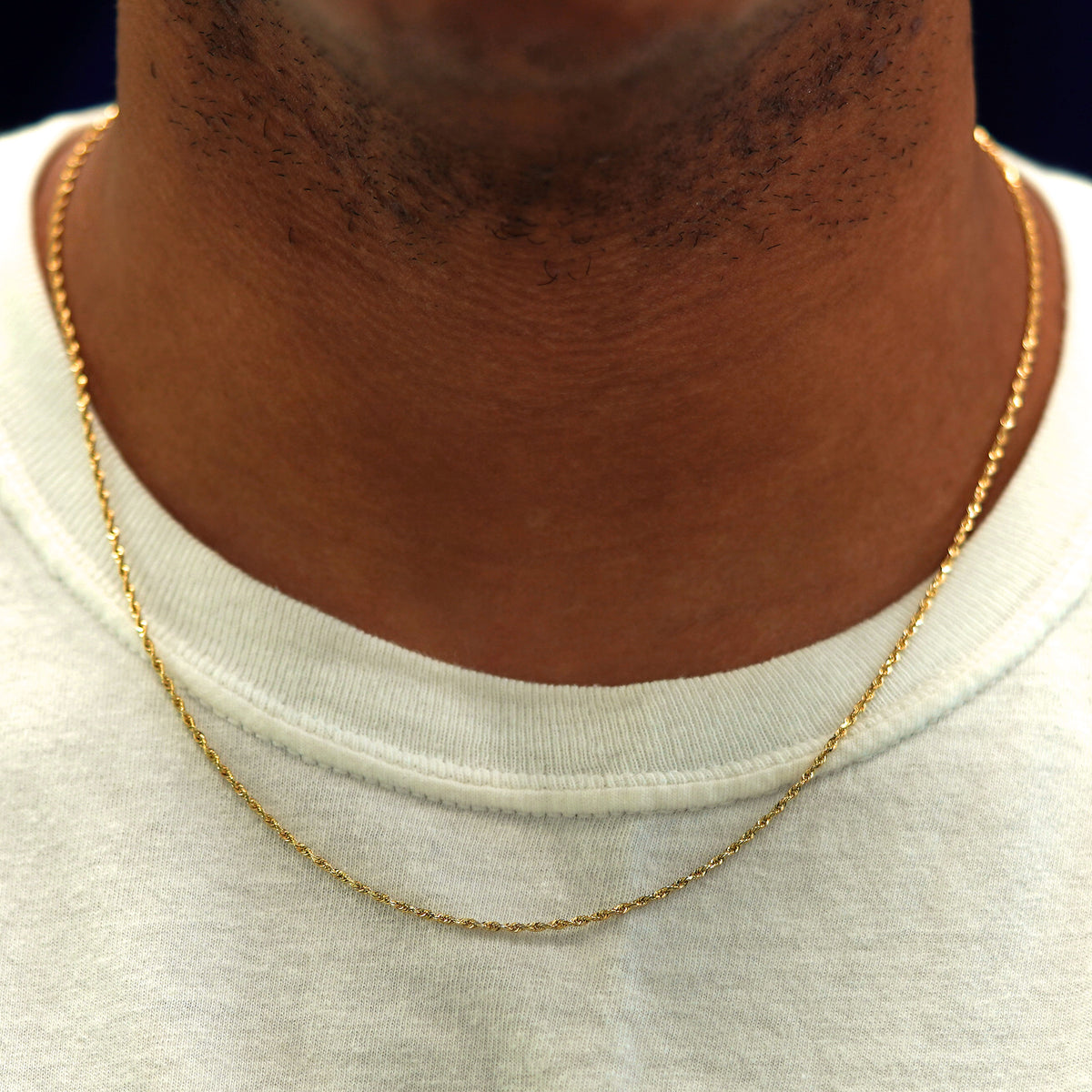 A model's neck wearing a solid yellow gold Rope Chain