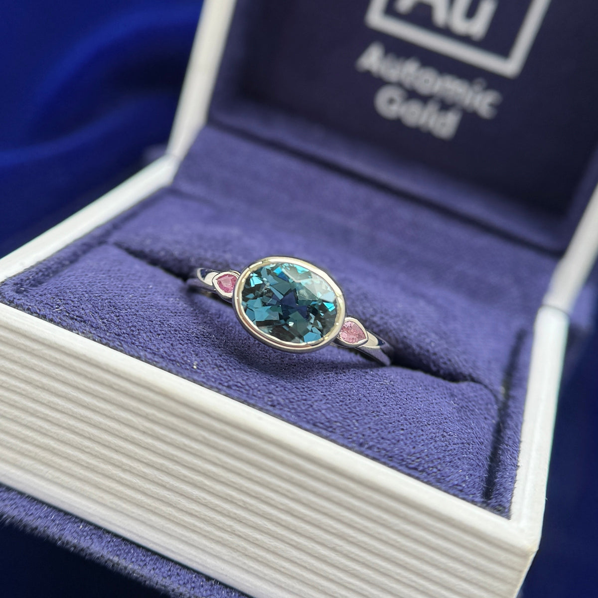 14k Yellow Gold and Oval Topaz Low-bezel-set East-west with 2pc 2mm Peach Sapphires on 2mm Mix Mirror Band Custom Ring, size 7.5