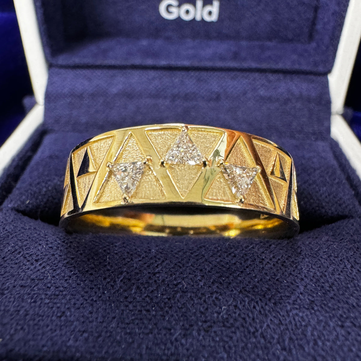 14k Yellow Gold & 3 Trillion Lab Diamond Zelda-inspired 6mm Band Custom Ring in a blue ring box