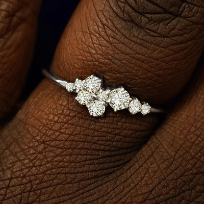 Close up view of a model's fingers wearing a 14k white gold Diamond Cluster Ring