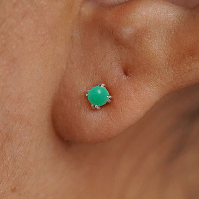 Close up view of a model's ear wearing a 14k white gold Green Jade Earring