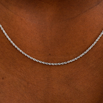 Close up view of a model's neck wearing a solid white gold Rope Chain