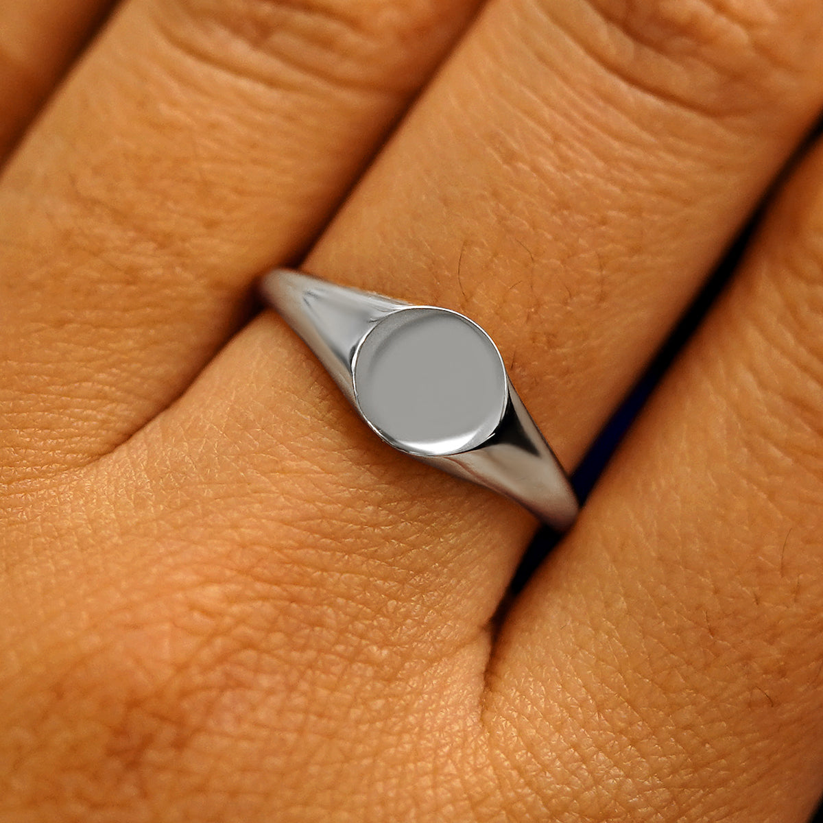Close up view of a model's fingers wearing a 14k white gold Signet Ring