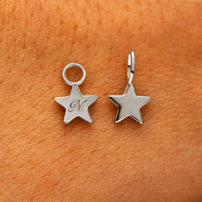 Two solid 14k white gold Star Charms showing the for chain and the for earring options
