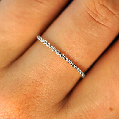 Close up view of a model's fingers wearing a 14k white gold Thick Cable Ring
